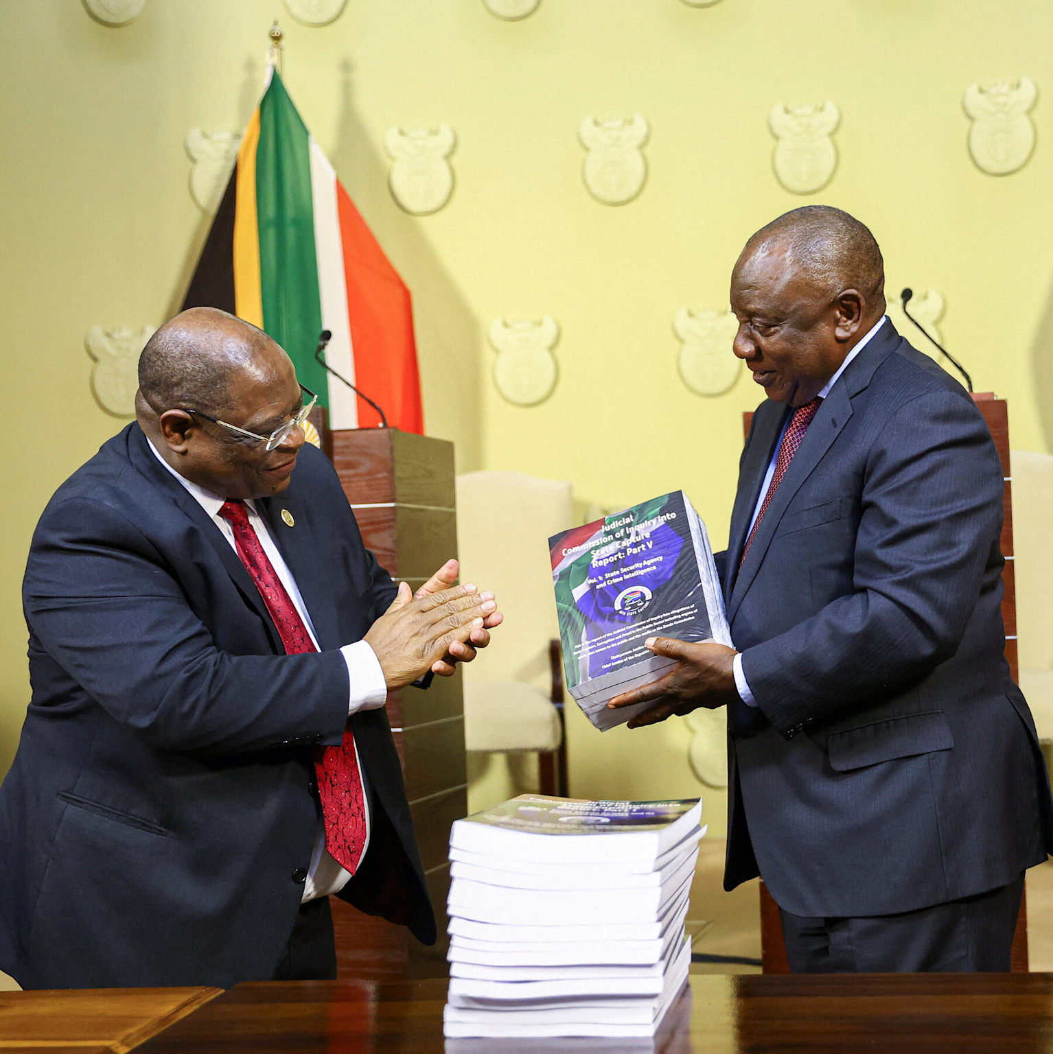 Presentation of South Africa's State Capture Commission report in an official setting, highlighting government-level corruption investigations